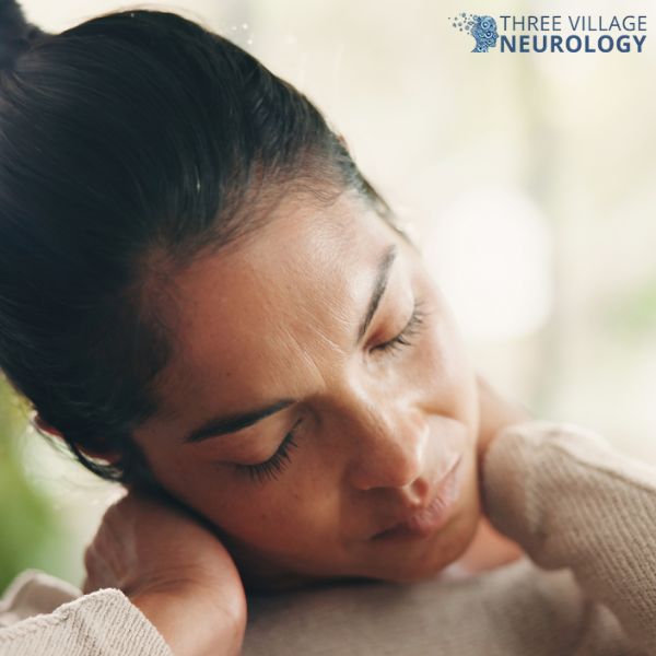 A woman with closed eyes holds her neck with both hands, appearing to experience discomfort, possibly from a pinched nerve in the neck. The Three Village Neurology logo is visible in the top right corner.